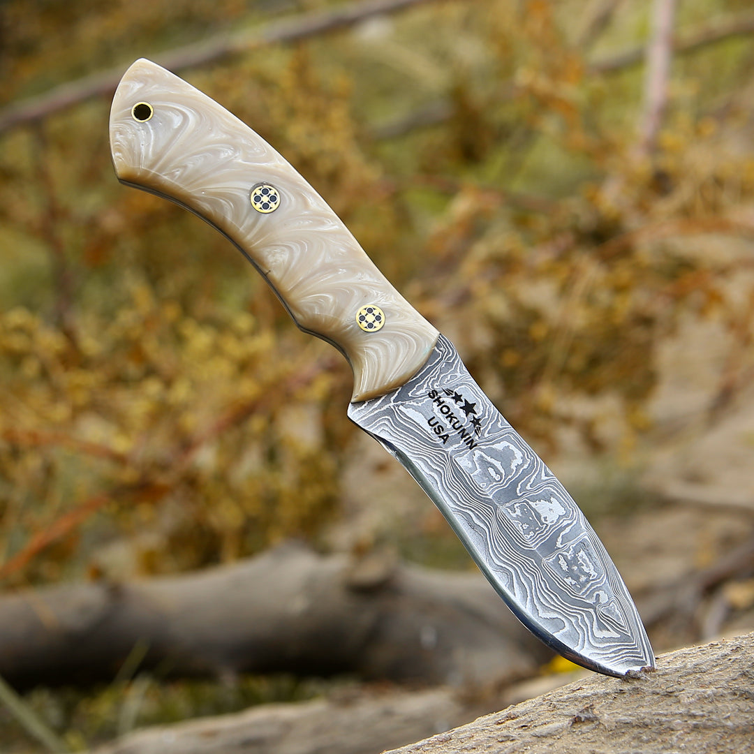 Knife with a decorative handle on a natural background
